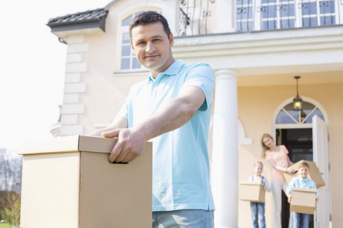 Staff assessing moving risks around a property entrance