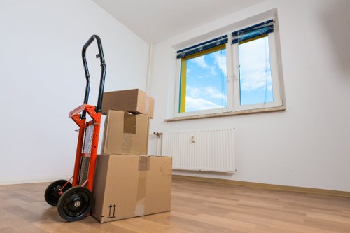 Mover wearing PPE while loading boxes into a van